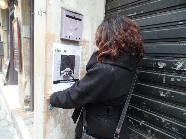 Plastering posters on Paris streets